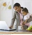 Working mother holding young child Working mother holding young child